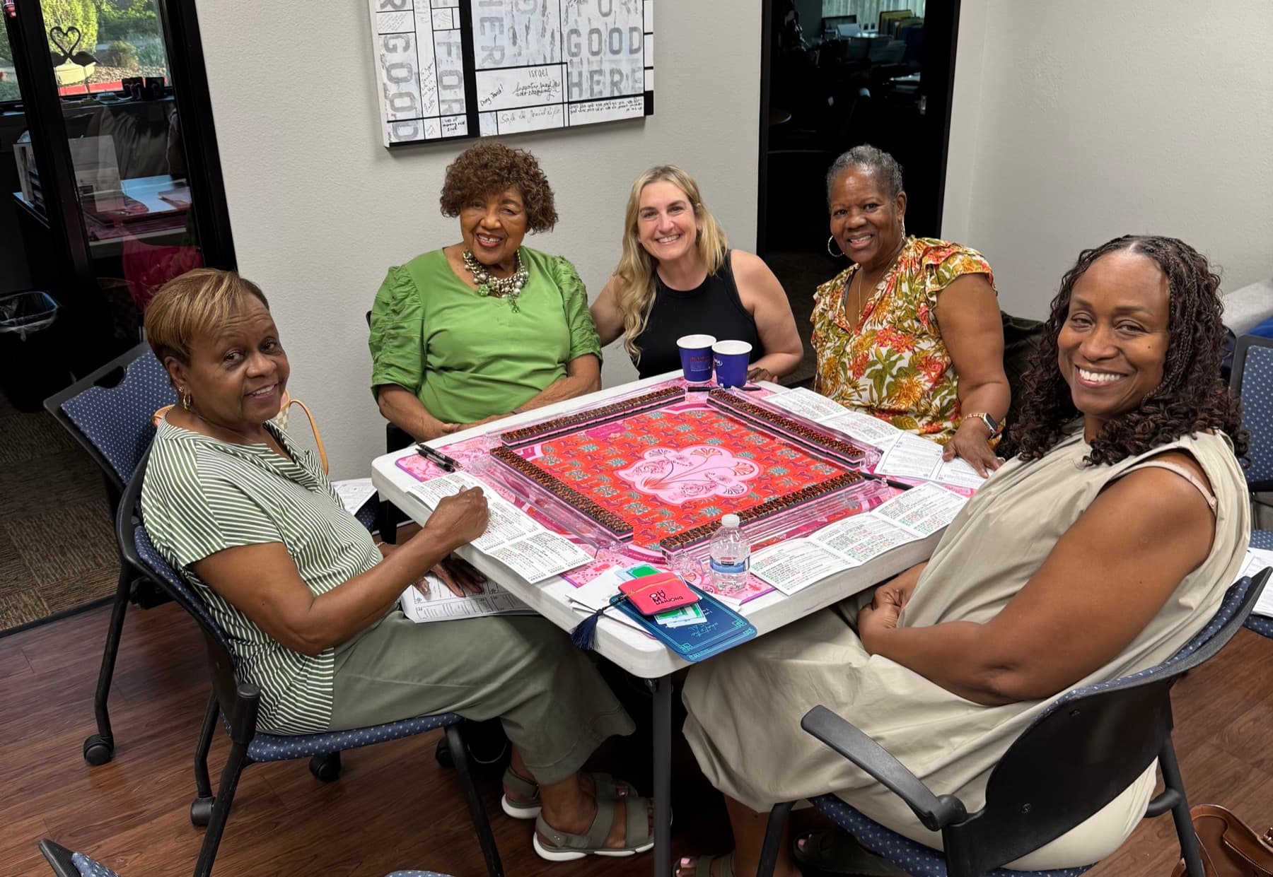 Shauna teaching American Mahjong to a community group around the table in Las Vegas