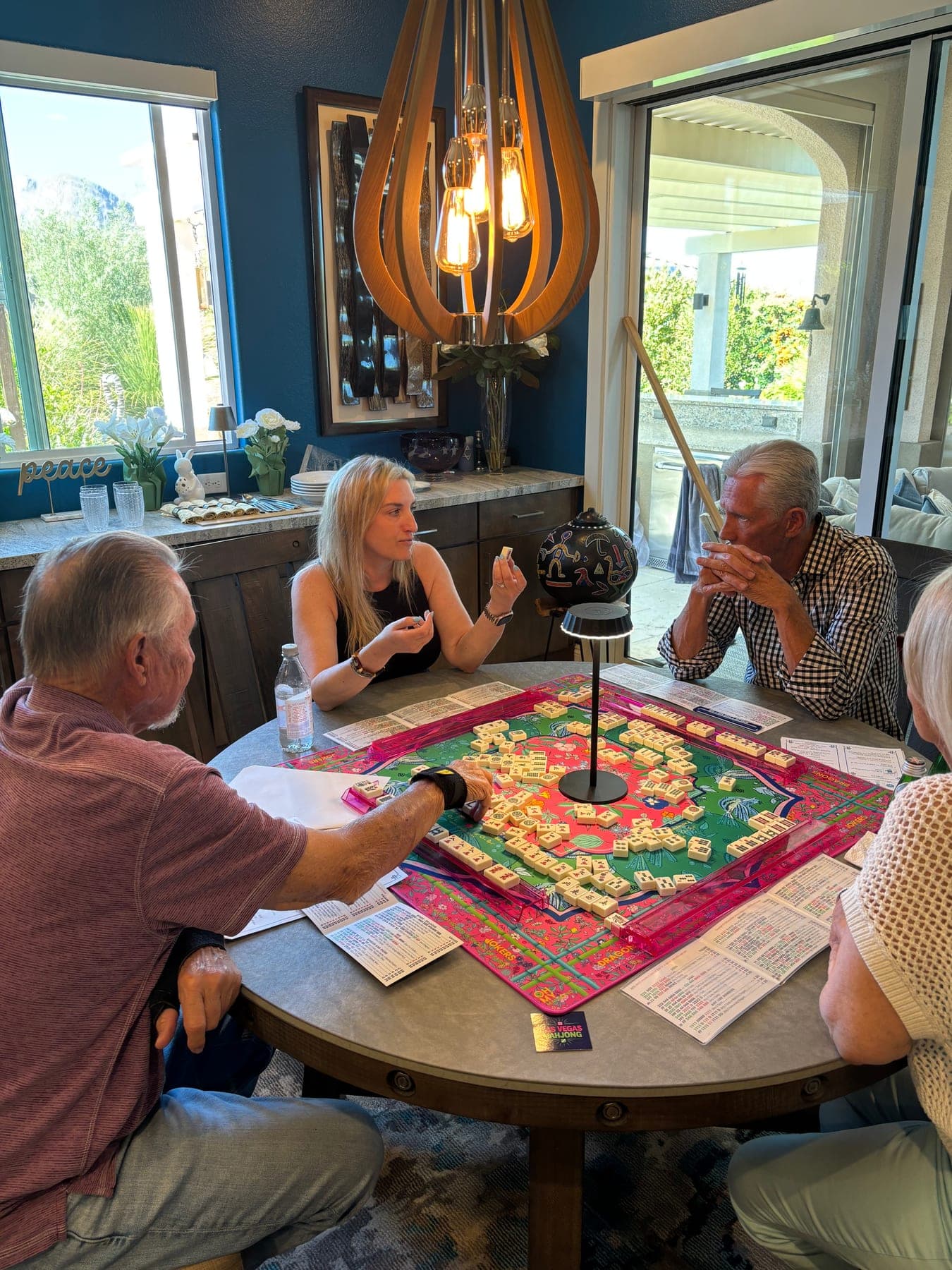 Shauna teaching American Mahjong to a group around the table at a lesson in Las Vegas